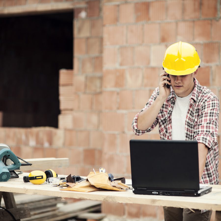 Carpenter talking on mobile phone